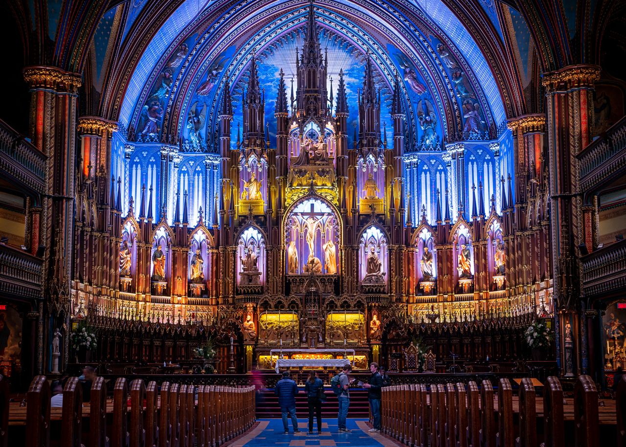 Explore the stunning gothic interior of Notre-Dame Basilica in Montreal, showcasing vivid stained glass and elaborate altars.